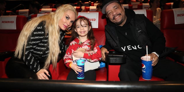Coco Austin, Chanel, and Ice T sit in a movie theater together