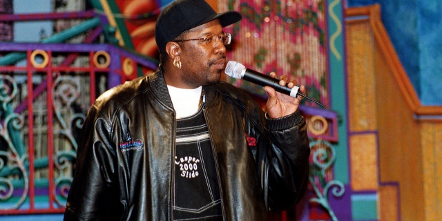 DJ Casper on stage holding a microphone