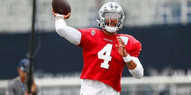 Dak Prescott throws at training camp