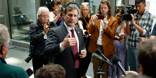 Dan Goldman speaks with press