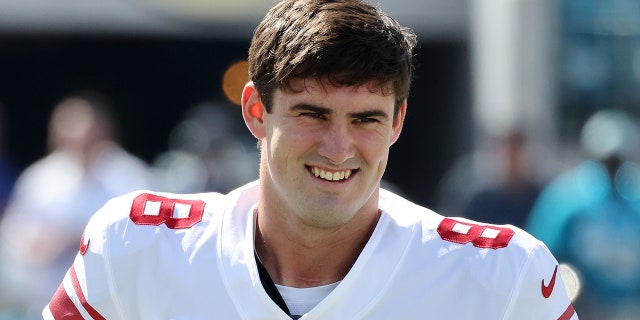 Daniel Jones smiles before game
