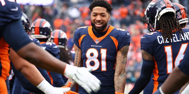 Tim Patrick greeted by Denver Broncos teammates