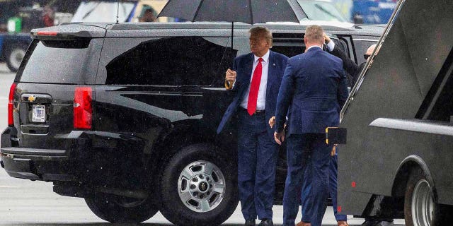 Donald Trump prepares to board his plane and depart Washington D.C.