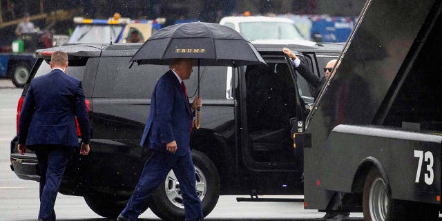 Donald Trump prepares to board his plane and depart Washington D.C.