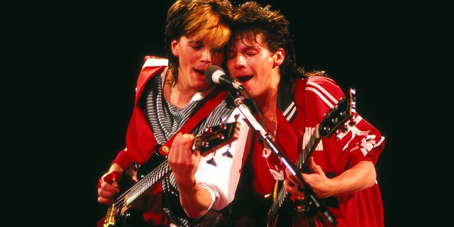John Taylor and Andy Taylor play guitars