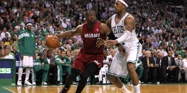 Dwyane Wade and Paul Pierce on the court