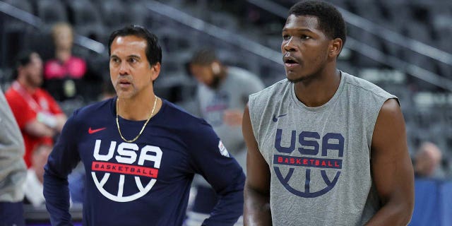 Erik Spoelstra and Anthony Edwards talk before a game