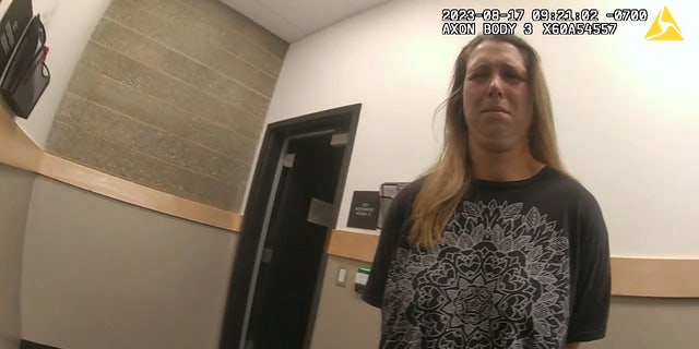 Shanna Gardner-Fernandez makes a strange face as she's handcuffed.