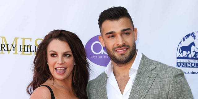 Britney Spears posing with Sam Asghari