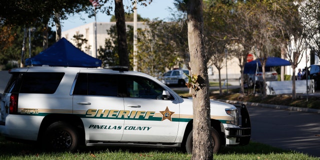 A Pinellas County Sheriff deputy parked along the road.