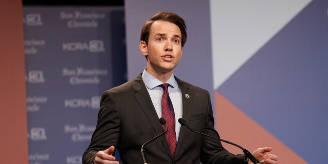 Kevin Kiley on stage during a debate
