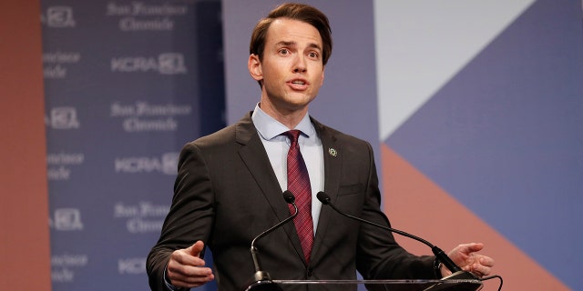 Kevin Kiley on stage during a debate