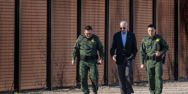 Joe Biden walking with border officials