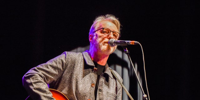 Billy Bragg performing on stage