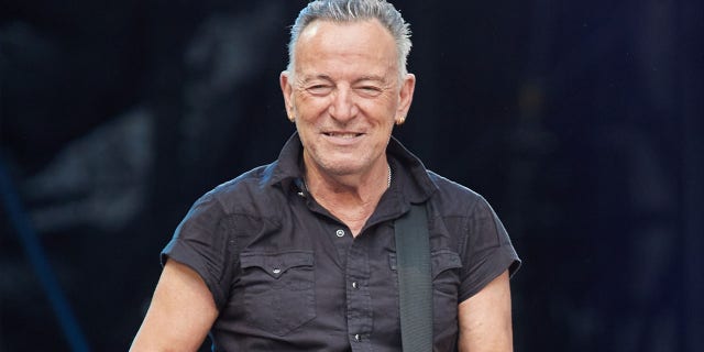 A photo of Bruce Springsteen performing