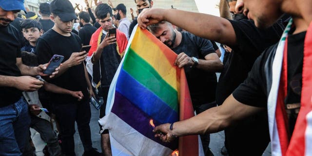 Quran Burning Protest LGBT Rainbow Flag