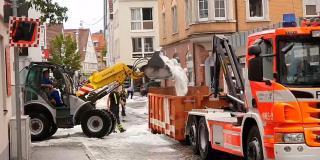 hail dumped from plow into dump truck