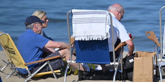 US First Lady Jill Biden (L) sits with US President Joe Biden (R)