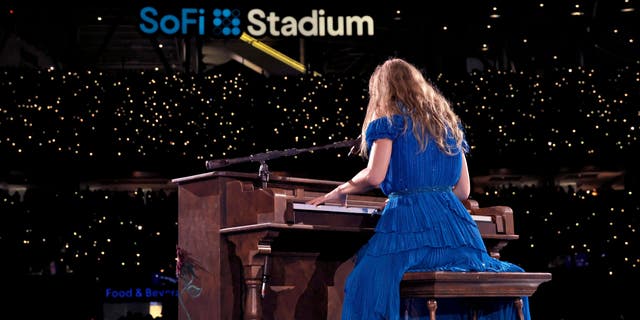 Taylor Swift plays the piano at SoFi Stadium