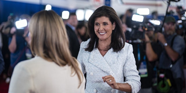 Nikki Haley walks into the spin room