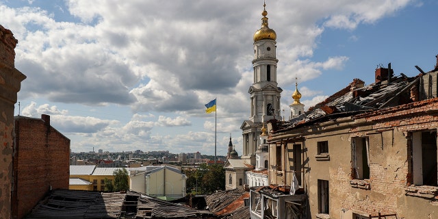 War-tattered town, Ukrainian flag