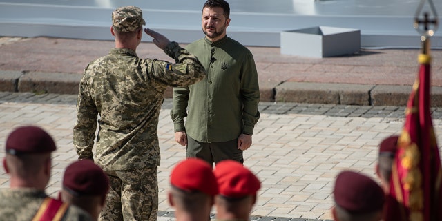 Soldier saluting, Zelenskyy