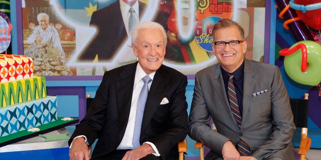 Bob Barker sitting with Drew Carey on the Price is Right Set