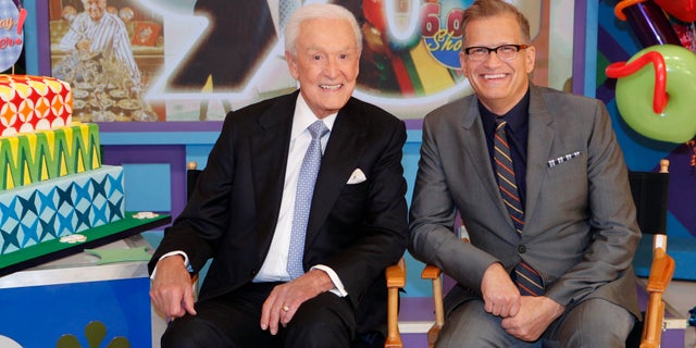 Bob Barker sitting with Drew Carey on the Price is Right Set