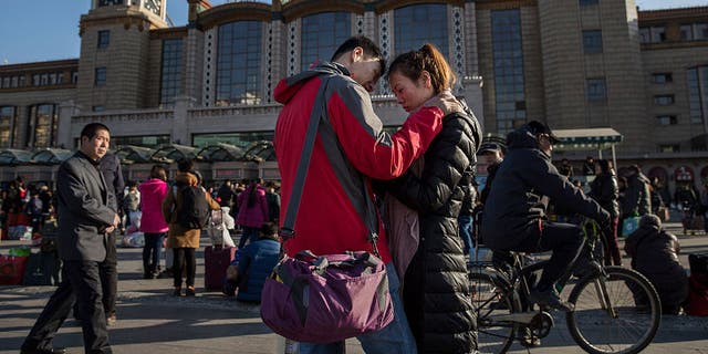 Chinese couple say good byes