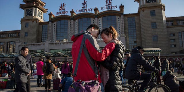 Chinese couple say good byes