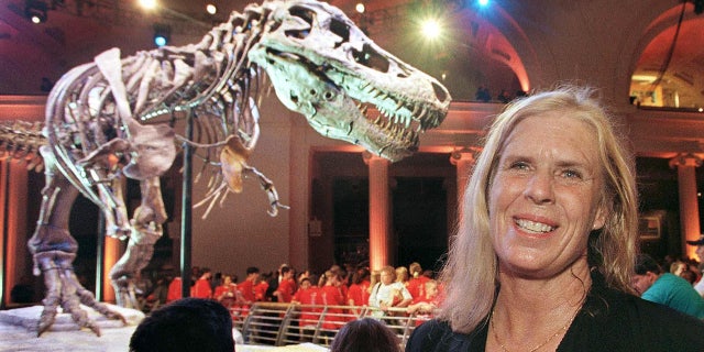 woman standing in front of T-Rex