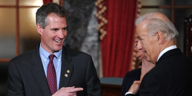 Senator Scott Brown (L)(R-MA) jokes with Vice President Joe Biden