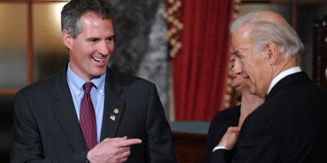 Senator Scott Brown (L)(R-MA) jokes with Vice President Joe Biden