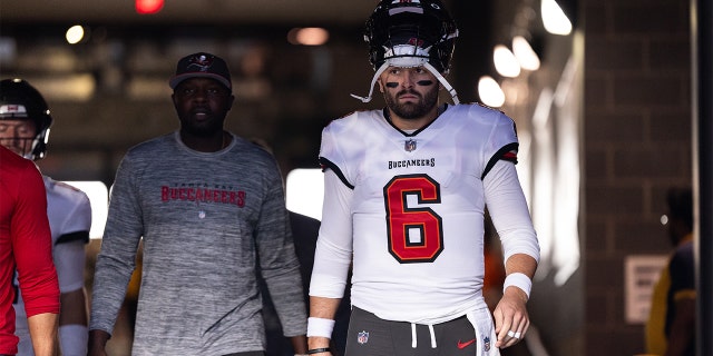 Baker Mayfield walks onto the field