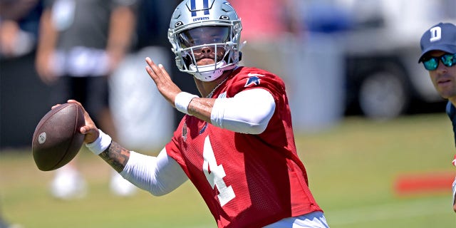 Dak Prescott throws at camp