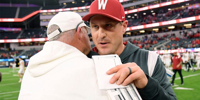 Jake Dickert congratulates the Freson State head coach