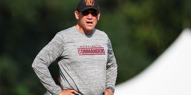 Ron Rivera looks on at training camp