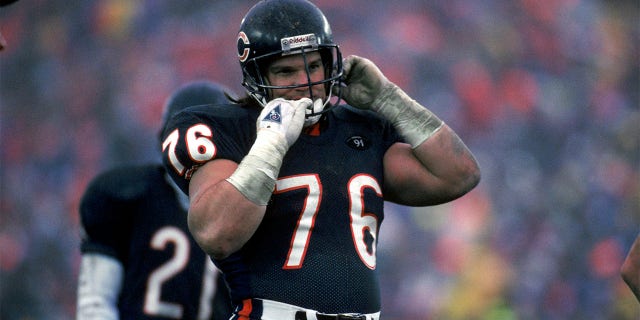 Steve McMichael removed his helmet