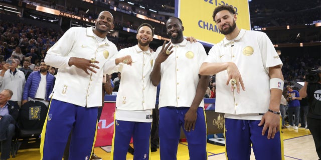 Members of the Warriors show off their championship rings