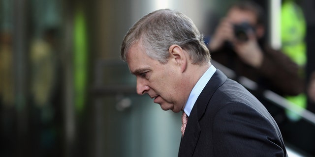 Prince Andrew looking down away from the camera