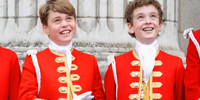 Prince George and Lord Oliver in matching red and gold coats