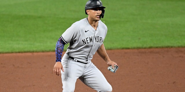 Giancarlo Stanton leads off second base