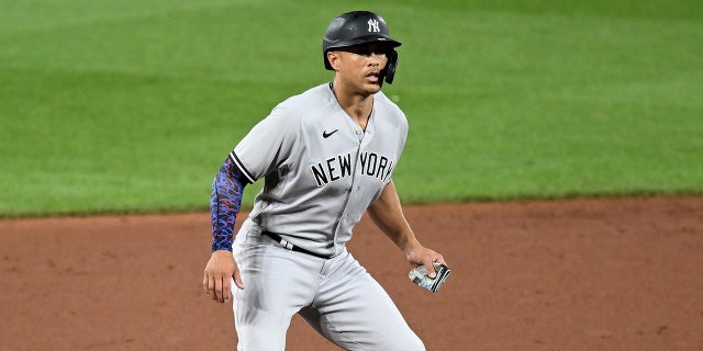 Giancarlo Stanton leads off second base