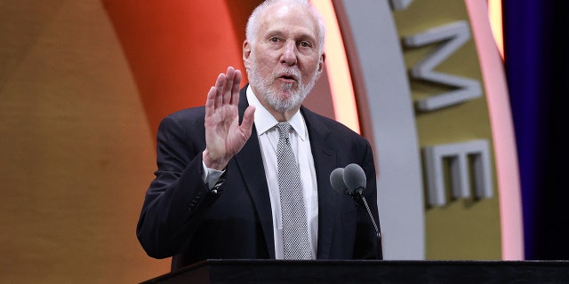 Gregg Popovich talks at podium