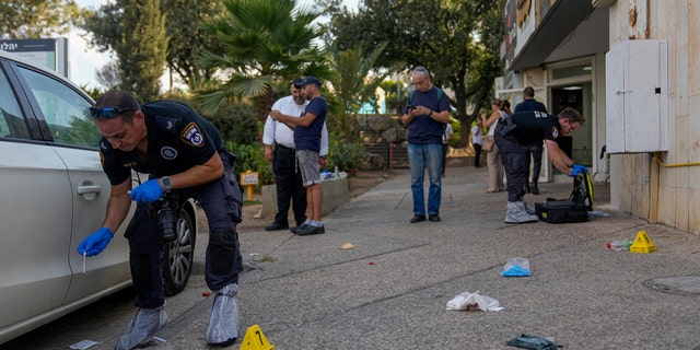 Israeli police inspecting shooting attack