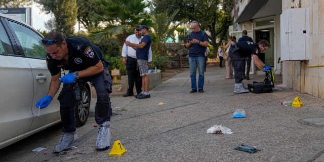 Israeli police inspecting shooting attack