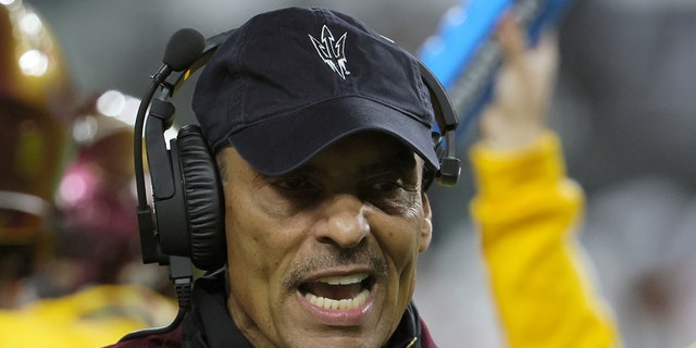 Herm Edwards talks on sideline