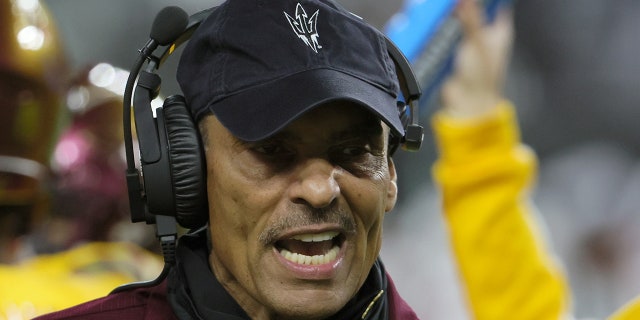 Herm Edwards talks on sideline