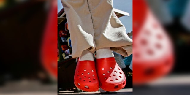 Pictured are red Crocs, similar to the ones Jacob Ortega wore when he allegedly robbed the Crumbl Cookies where he used to work.