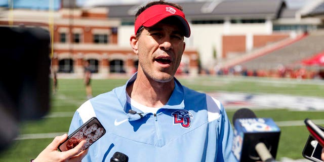 Liberty coach Jamey Chadwell speaks to the media